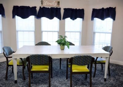 Family gathering area at Charter Senior Living of Paris in Paris, TN with natural light and cozy seating